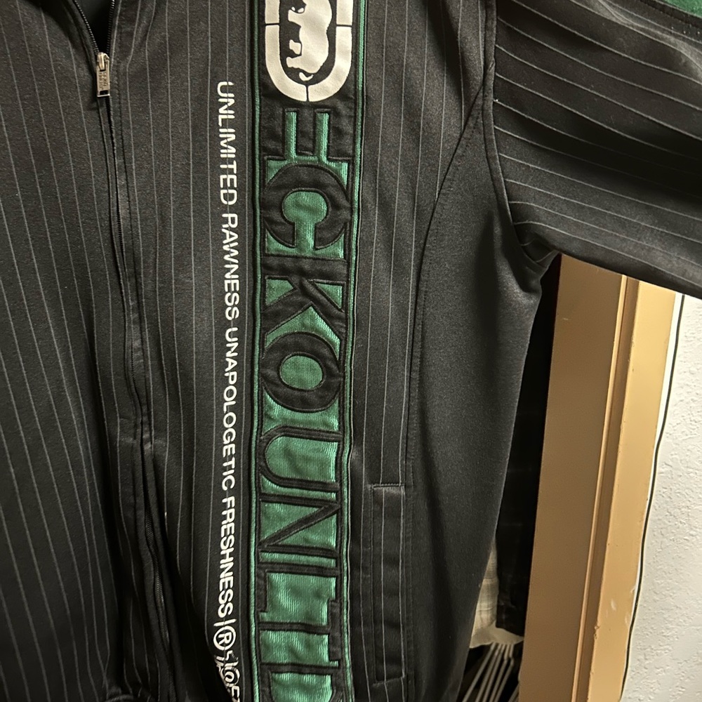 green zip up